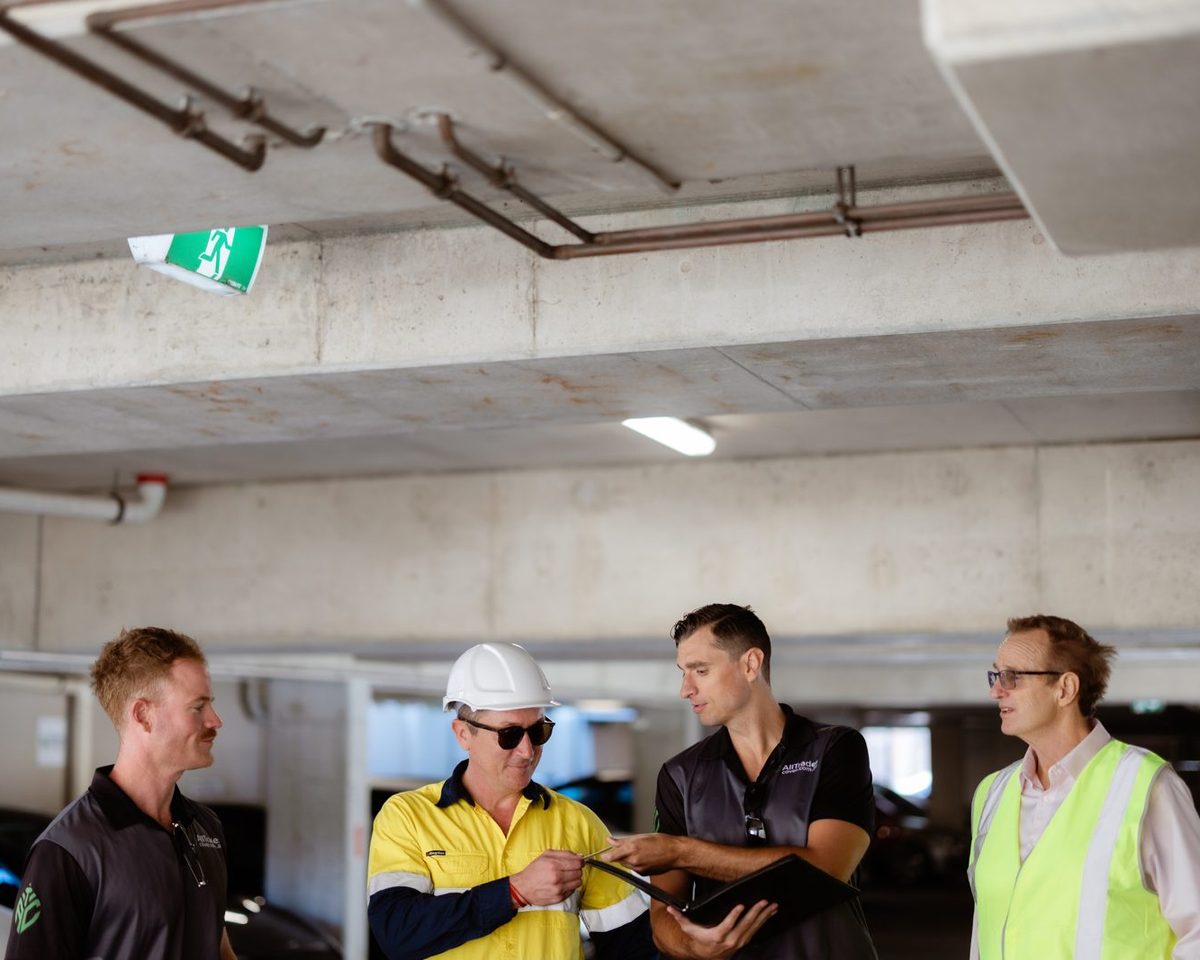 An ATC broker in discussion with a client on site