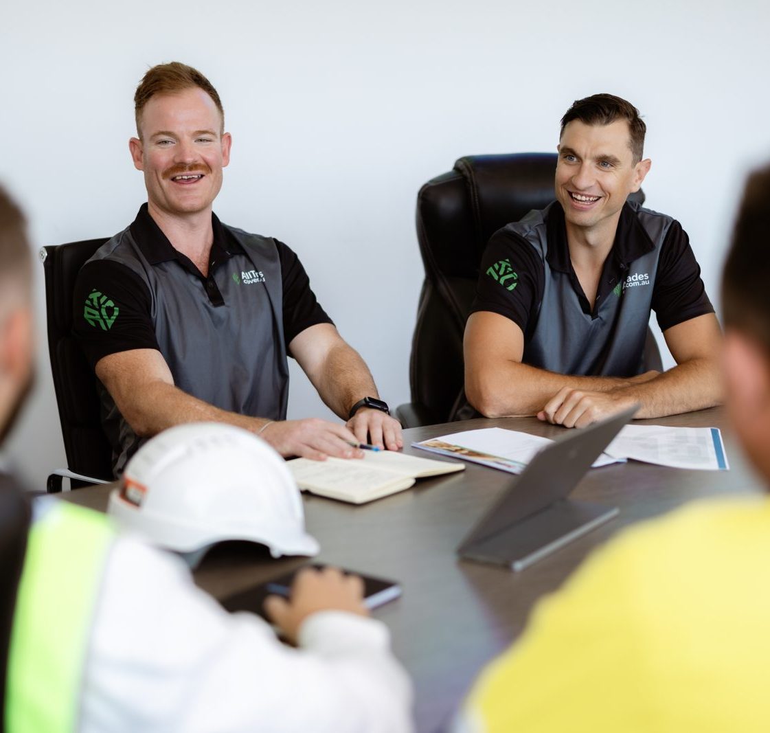 Senior brokers reviewing a programme with a client on site